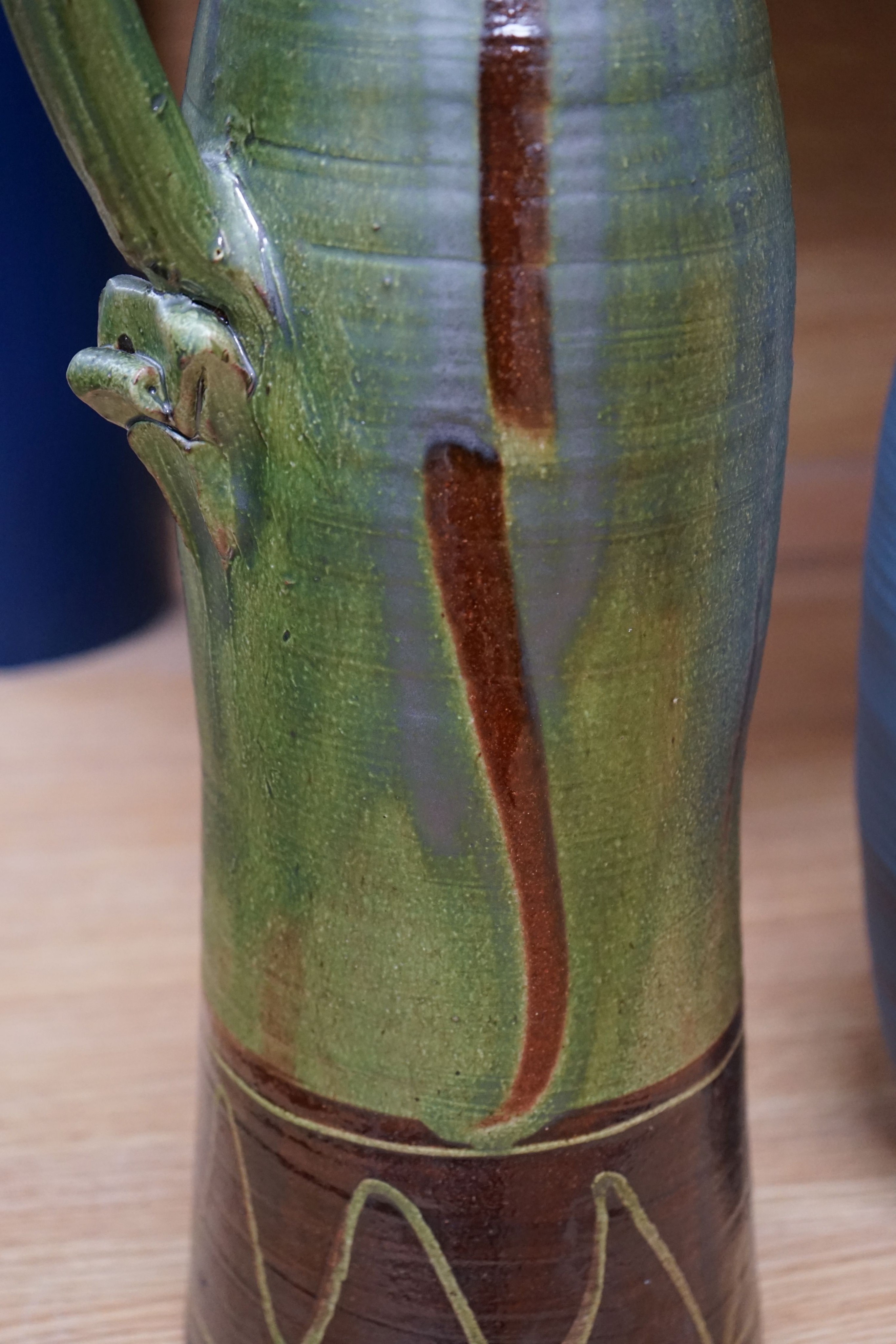 Clive Bowen (b.1943), a tall green glazed and brown slip decorated ewer, 59cm